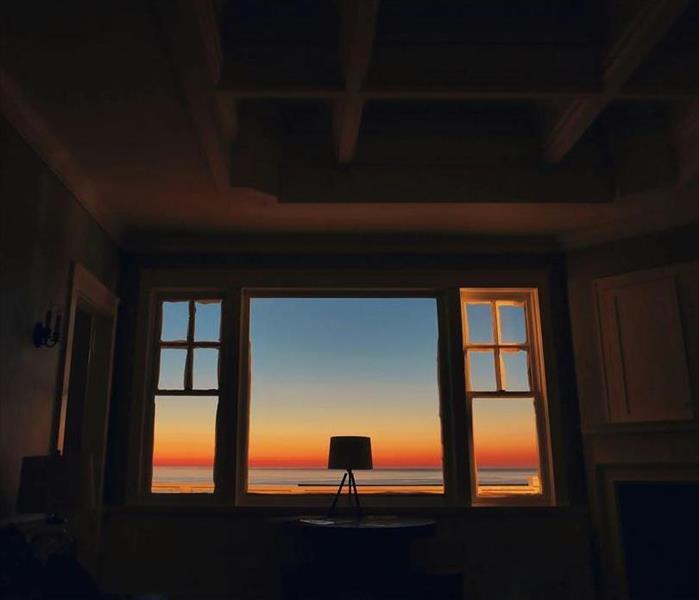 A photo looking out a window with a nice sunset