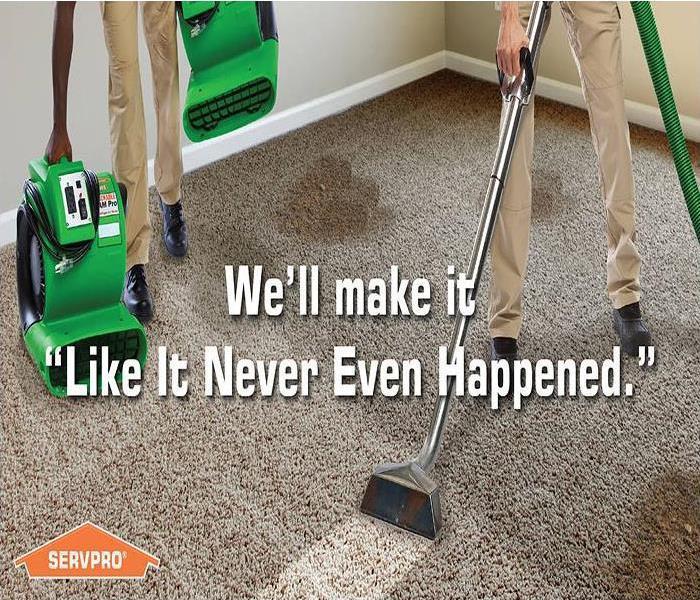 Two men steam cleaning a dirty carpet with the tagline, We'll make it, "Like it never even happened."